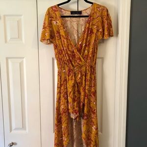 Francesca’s romper with high to low skirt overlay